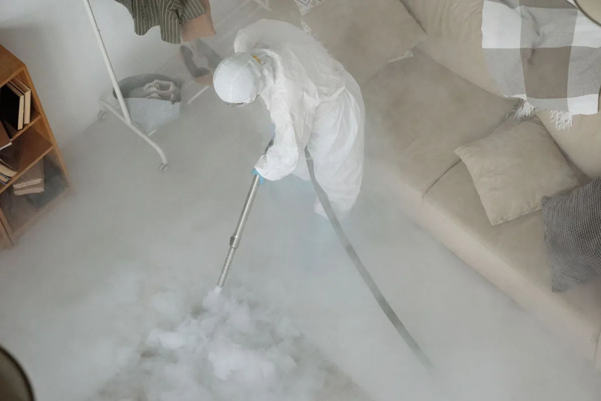 Biohazard cleanup technician in protective equipment, Random Lake, WI